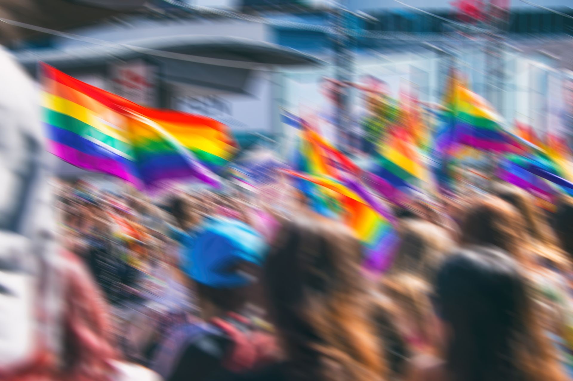 Motion blurred picture of a gay rainbow flag during pride parade. Concept of LGBT rights.